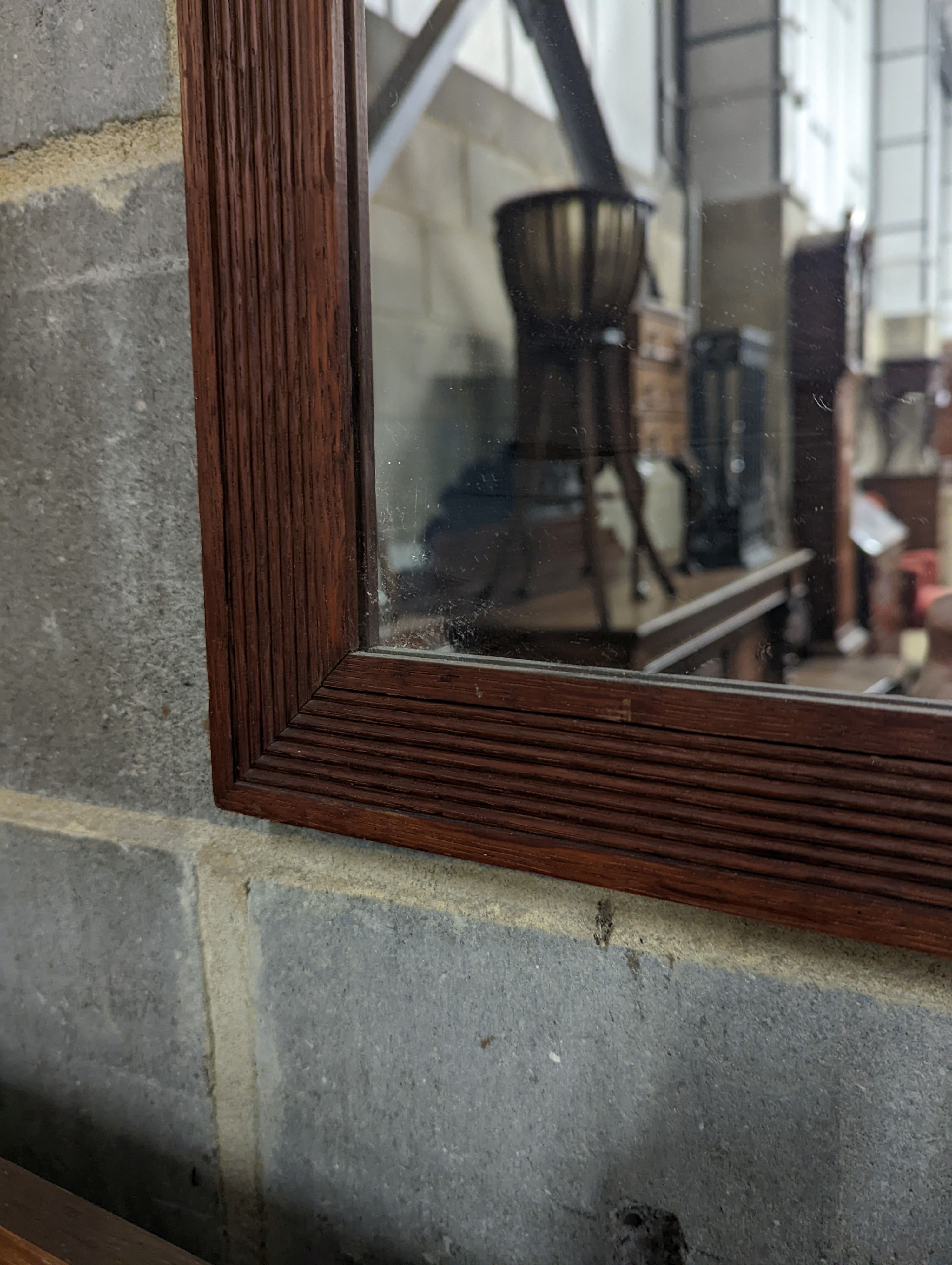 An oak framed rectangular wall mirror with fluted border, width 79cm, height 99cm